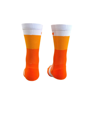 The ”Trio White, Light Orange, and Dark Orange ” is a 6" men and women's cycling and running sock with compression.