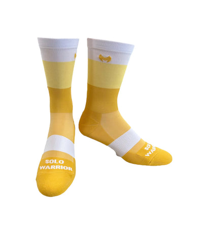 The ”Trio White, Yellow, and Mustard ” is a 6" men and women's cycling and running sock with compression.