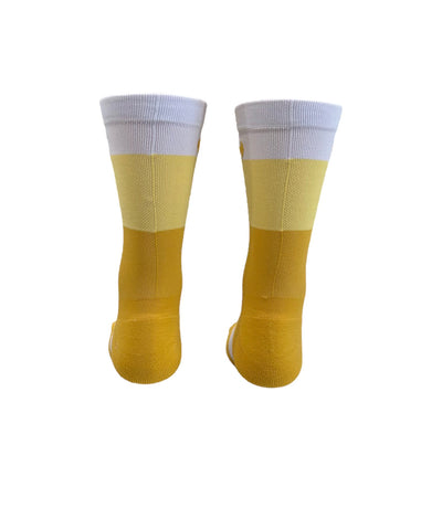 The ”Trio White, Yellow, and Mustard ” is a 6" men and women's cycling and running sock with compression.