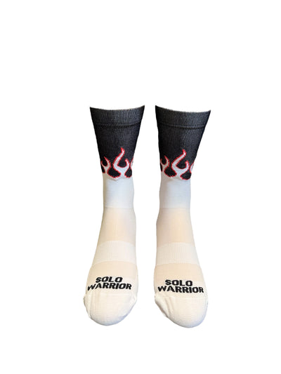 “The Fire” is a 6" White, Orange and black, men and women's cycling, running, and fitness sock with compression