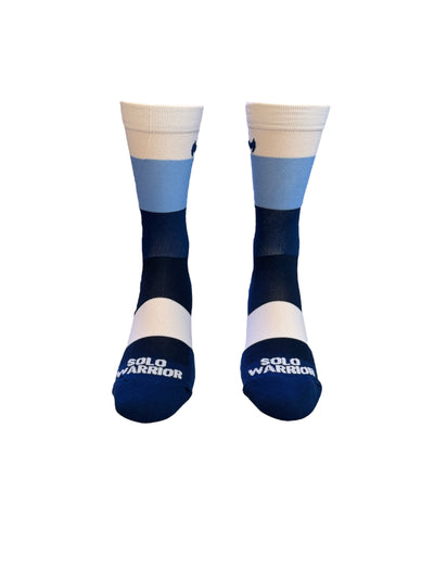 The ”Trio White, Light blue, and Navy Blue ” is a 6" men and women's cycling and running sock with&nbsp;compression.