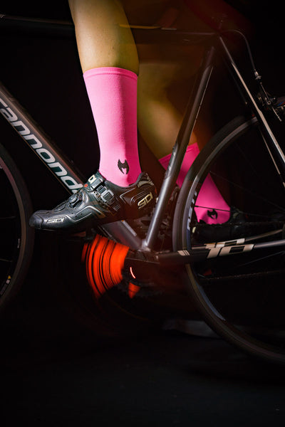 Solid Neon Pink 6" Men's & Women's cycling socks with compression.