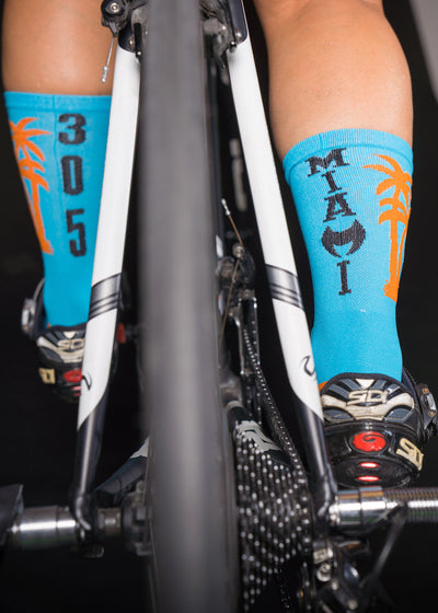 305 Miami blue 6" Men's and Women's cycling sock with compression.